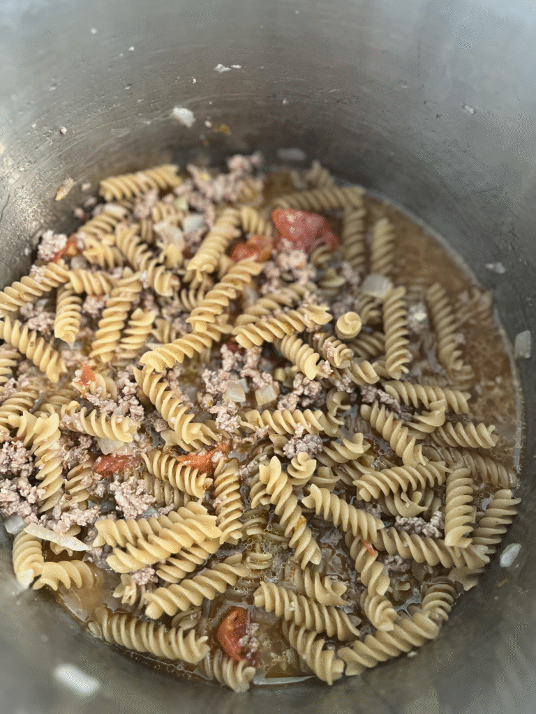 pasta added to instant pot for homemade dinner