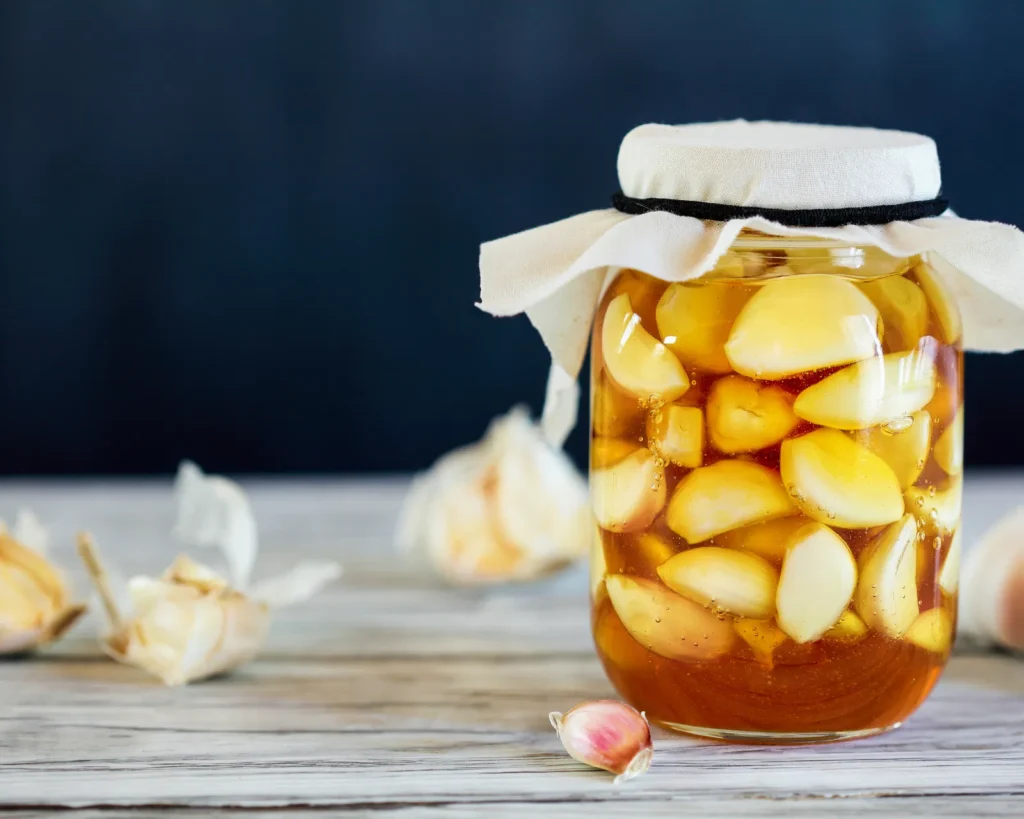 fermented garlic honey in glass jar