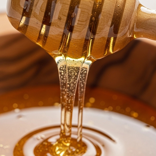 Honey in wooden bowl