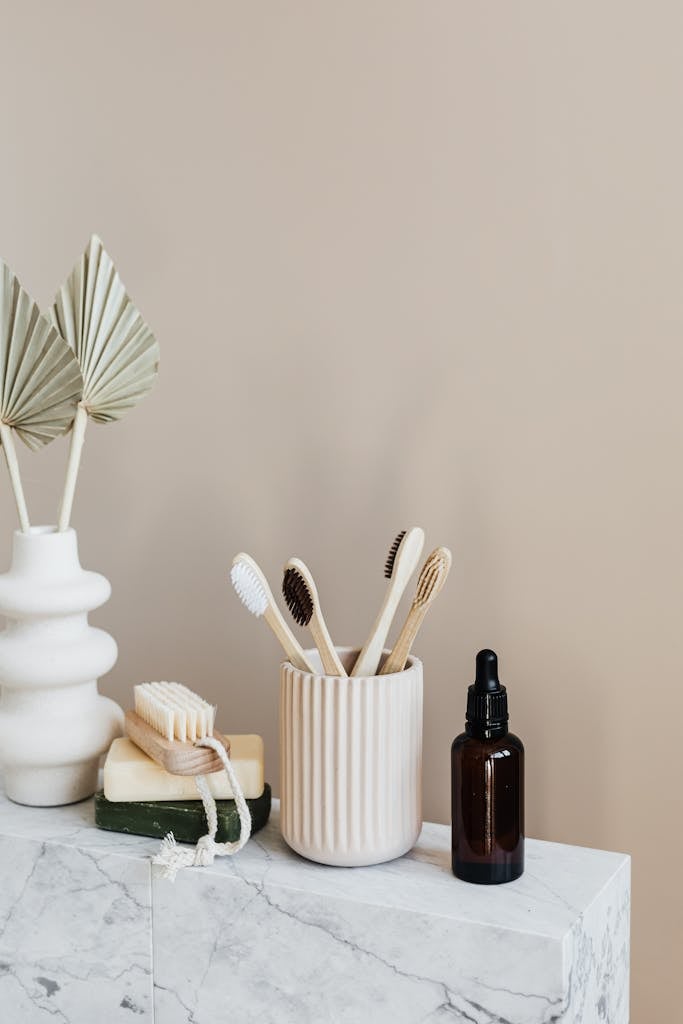 Collection of bamboo toothbrushes and organic natural soaps with wooden body brush
