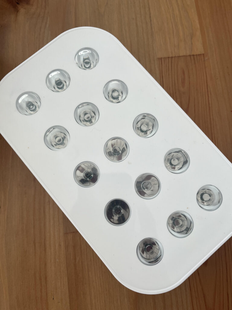 Red Light Therapy Lumebox on wooden table