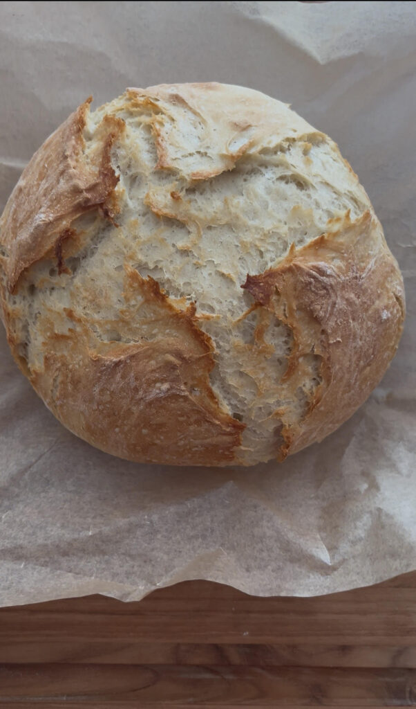 Finished homemade bread load on parchment paper