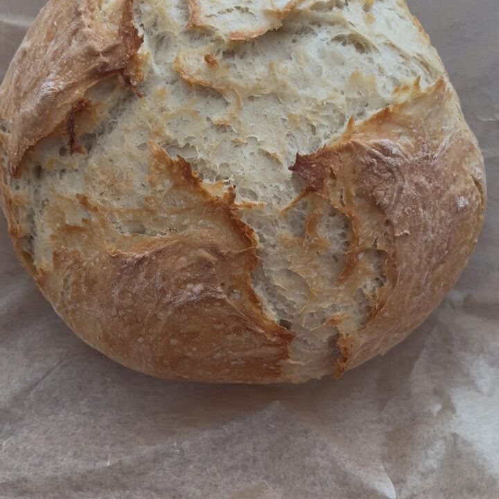 Finished homemade bread load on parchment paper